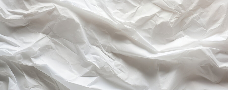 Closeup of a crinkled tracing paper texture, showcasing its lightweight and flexible nature with a crinkled, almost wrinkled appearance.