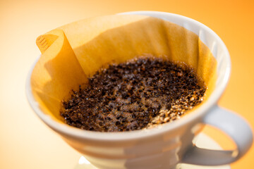 Used coffee grounds on the paper filter