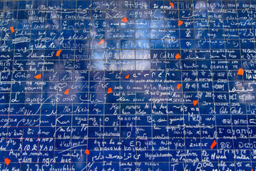 Wall of Love, a travel landmark with different languages of love on the wall in  Montmartre, Paris, France, Europe