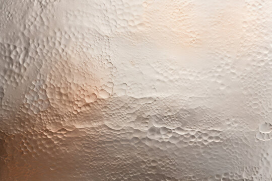 Texture of lightly hammered metal A gentle hammering technique has resulted in a smooth, almost honeycomblike texture on the surface of this metal. The strikes are more spaced out and the