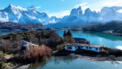 Country House Of Torres Del Paine In Punta Arenas Chile. Snowy Mountains. Glacial Scenery. Punta Arenas Chile. Winter Travel. Country House At Torres Del Paine In Punta Arenas Chile. - obrazy, fototapety, plakaty