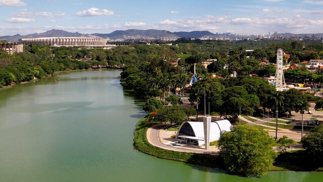 Metropolis aerial view of landmark Pampulha lake and sports centre stadium near amusement park at downtown Belo Horizonte Minas Gerais Brazil. Landmark of city.