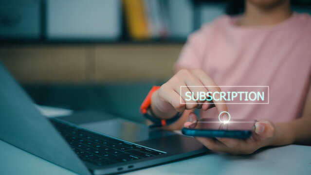 Female hand pressing subscription button with the word subscribe on futuristic virtual interface screen. Online registration concept.