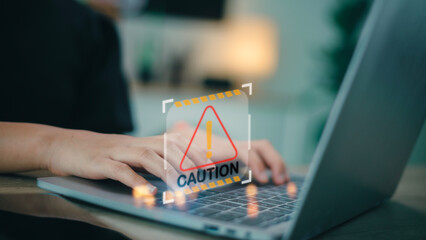 programmer, developer using computer laptop with triangle caution warning sign for notification error and maintenance concept.