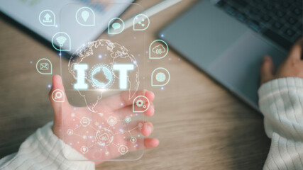 IOT  on a futuristic virtual interface screen. Internet of Things or IoT technology concept, with icons of typical IoT.