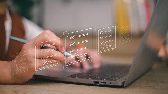 E-signing, electronic signature, document management, paperless office. Hand signing on e-document on a digital tablet, virtual notepad on virtual screen, Online contract signing with application