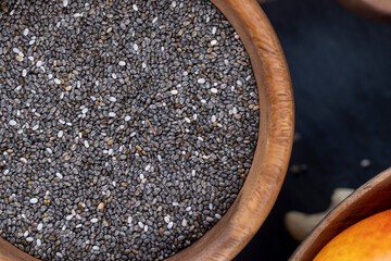 raw chia seeds rich in vitamins and minerals , wooden bowl