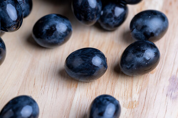 Unwashed blue grapes in the dust