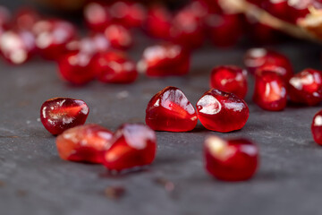peeled red ripe pomegranate with red sweet grains
