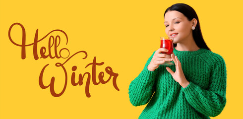 Banner with pretty woman drinking tasty mulled wine and text HELLO, WINTER - obrazy, fototapety, plakaty