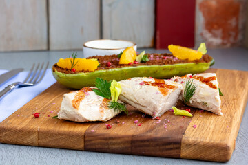 Grilled chicken breast with vegetables. Home made food. Concept for a tasty and healthy meal. Wooden background. Close up.