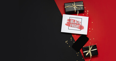 Phone, gifts and paper with inscription BLACK FRIDAY on color background with space for text