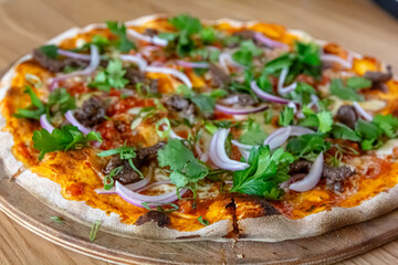 delicious steak pizza with beef and onions