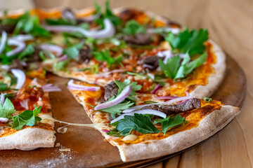 delicious steak pizza with beef and onions