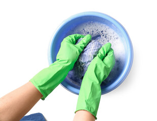 Woman in green rubber gloves washing clothes in plastic basin isolated on white background