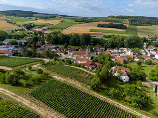 Aerial view on hilly vineyards and village Urville, champagne vineyards in Cote des Bar, Aube, south of Champange, France