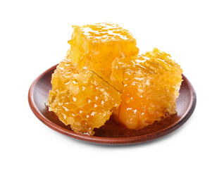 Plate with sweet honeycombs on white background
