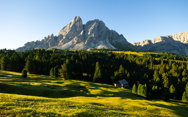 Obraz premium Scenic view of Valley against Munt de Fornella in Dolomites mountains. South Tyrol, Italy, Europe