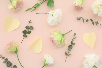 Paper hearts with carnation flowers on pink background. National Sweetest Day