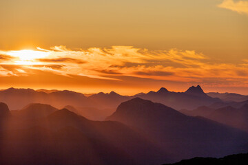 wispy clouds over moutains 