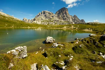 Papier Peint photo Dolomites Breathtaking natural landscape with small alpine lakes Laghi dei Piani with emerald waters nestled amidst Italian Dolomite mountains with towering rocky peaks on sunny summer day