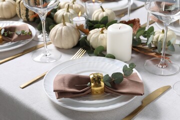 Beautiful autumn table setting with floral decor