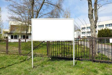 Empty signboard outdoors on sunny day. Mock-up for design