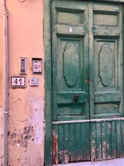 Green door on stucco