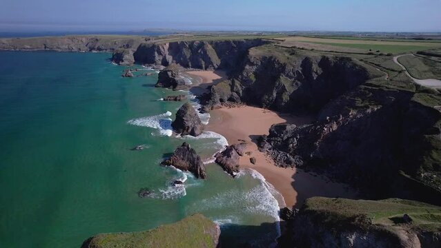 Scenic Aerial View Over Bedruthan Steps with Turquoise Seaside Along the Rocky Cornish Coastline in Cornwall, England, UK.