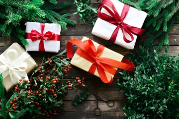 Christmas decorations, festive packaging, boxes with gifts lie on the table.