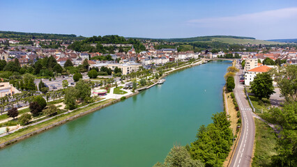 Aerial view of the small town of Château-Thierry overlooked by a mediaeval castle built in the 15th century along the banks of the River Marne in the French department Aisne in Picardie - obrazy, fototapety, plakaty