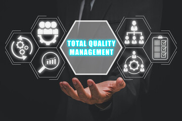Total quality management concept, Businessman hand holding total quality management icon on virtual...