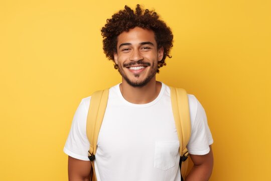 A man with curly hair wearing a backpack