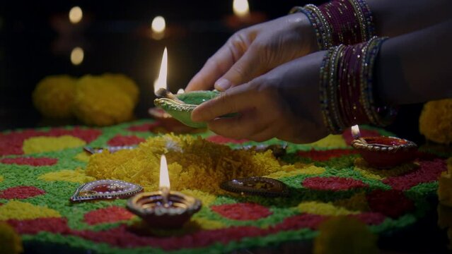 Clay diya lamps lit during diwali celebration, Diwali, or Deepavali, is India's biggest and most important holiday.