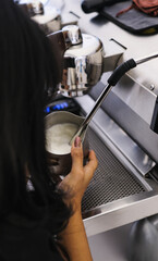 Barista Operating Espresso Machine