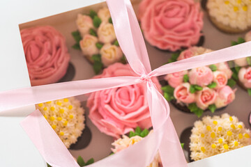 Delicious Gourmet Cupcakes Topped with Buttercream Frosting Flowers