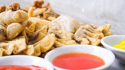 Nusantara Platter: A Flavorful Feast of French Fries, Crispy Fried Chicken Skin, Fried Mushroom, and Bakso Tahu Special with Delicious Condiment Sauces