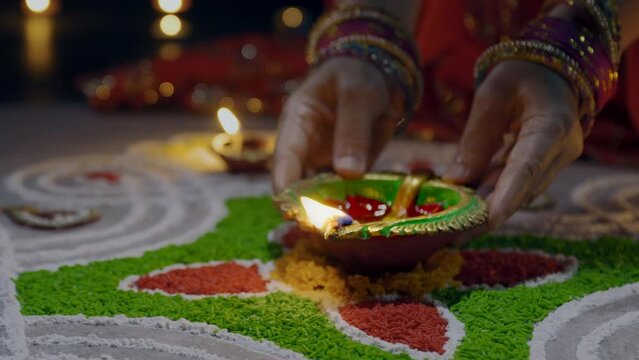 Clay diya lamps lit during diwali celebration, Diwali, or Deepavali, is India's biggest and most important holiday.