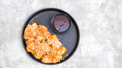 Crispy Banana Fritter Delight with Cheese, Almond Topping, and Strawberry Jam Dip