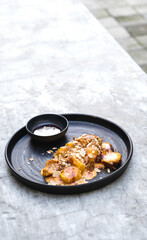 Crispy Banana Fritter Delight with Cheese, Almond Topping, and Strawberry Jam Dip