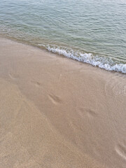 Soft beautiful ocean wave on sandy beach. Background
