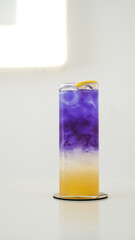Vibrantly Layered and Refreshing Mocktail in Purple, White, and Yellow