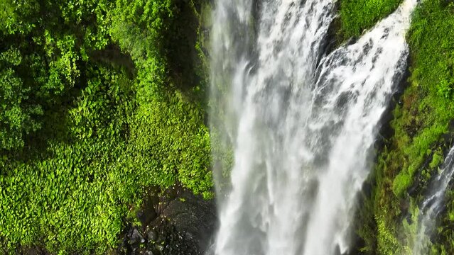 Lasang Falls with rapid stream and greenery plants. Bukidnon, Philippines.