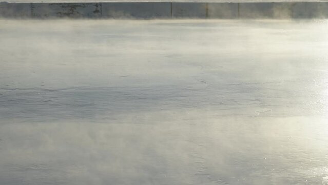Steam Rising from a Freshly Resurfaced Outdoor Hockey Rink