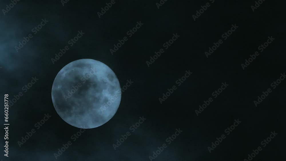 Wall mural clouds passing by the hollow bright moon. clouds on a full moon. close-up. blank space for text. mys
