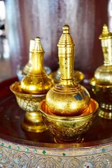 Fototapeta na wymiar Bottles to pour water of dedication, to make a libation ceremony Buddhism original in Thai.