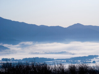 Temperature inversion forms cloudsea in snowy town and lake (Inawashiro, Fukushima, Japan)