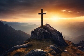 A cross standing on top of the mountain at Sunrise, religious concept background.
 - obrazy, fototapety, plakaty