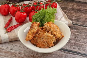 Fried salmonn cutlet in the bowl