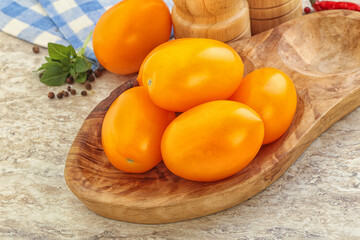 Sweet ripe yellow tomato in the bowl